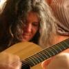 photo of Mary Shapiro playing guitar
