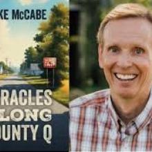 Mike McCabe and the cover of his book, Miracles Along County Q