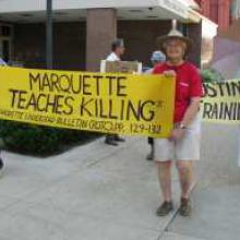 Bob Graf and others holding signs at protest