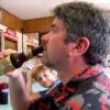 photo of Joe Fahey drinking a bottle of beer at a bar